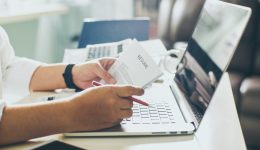 graphicstock-business-man-review-his-resume-on-his-desk-laptop-computer-calculator-and-cup-of-coffeeseleted-focus_HOQeU8nDxog